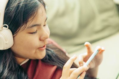 Close-up of young woman drinking water