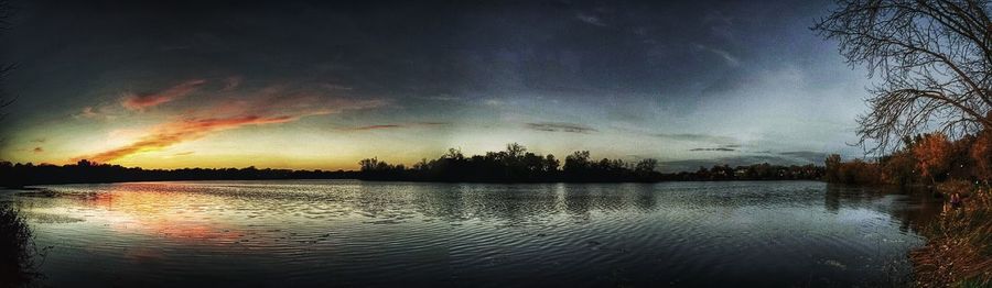 Scenic view of lake against sky during sunset