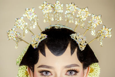 Beautiful model, wearing javanese indonesian wedding dress.