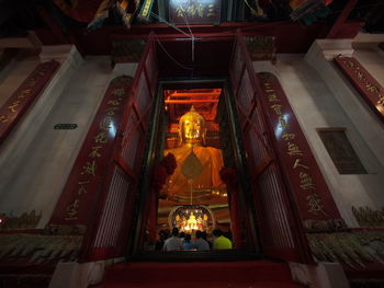 Low angle view of statue at illuminated temple