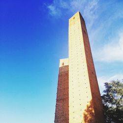 Low angle view of building against blue sky