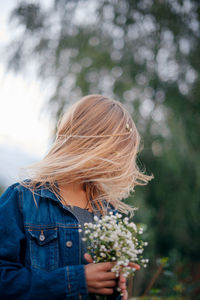 Rear view of woman looking away