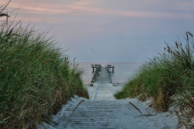 High angle view of jetty leading towards sea