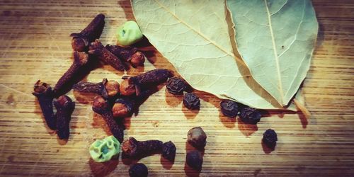 High angle view of leaves on wooden table