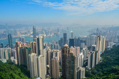 Aerial view of modern buildings in city against sky