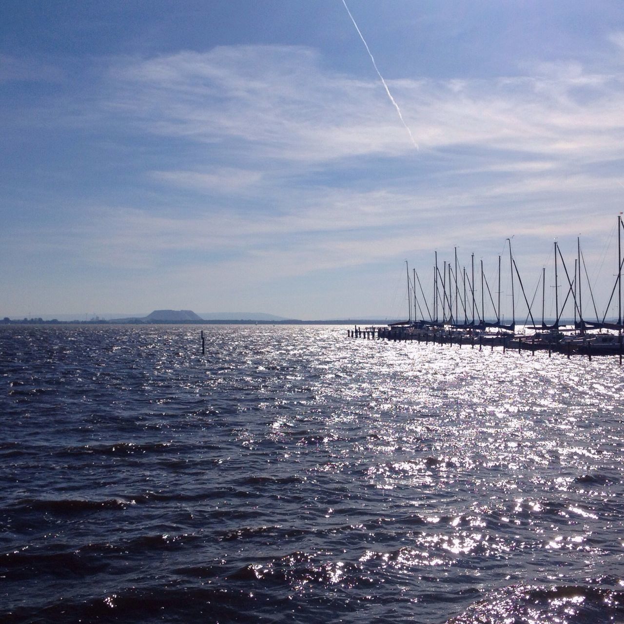 sea, water, sky, waterfront, nautical vessel, transportation, tranquil scene, rippled, scenics, tranquility, sailboat, nature, horizon over water, cloud - sky, beauty in nature, mode of transport, boat, cloud, mast, blue