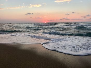 Scenic view of sea against sky during sunset