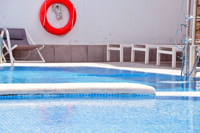 View of swimming pool against wall