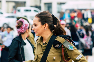 Portrait of woman looking at city