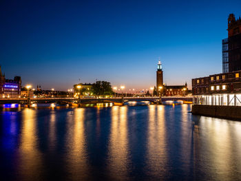 Illuminated buildings at waterfront