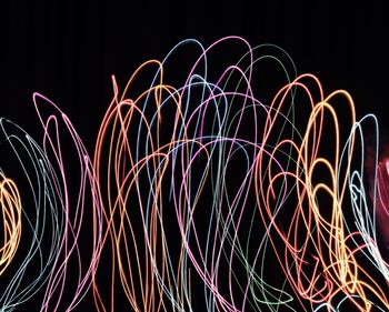 Light trails against sky at night