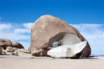Rocks in desert against sky