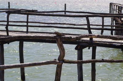 Close-up of railing against sea