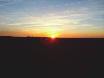 Scenic view of landscape at sunset