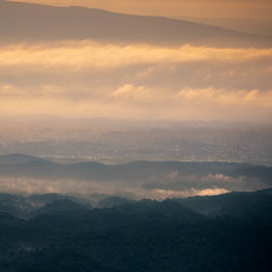 Scenic view of mountains against sky during sunset