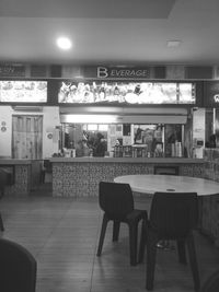 Empty chairs and tables in cafe