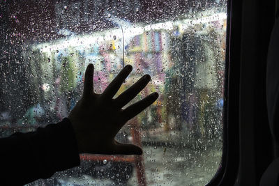 Reflection of person on glass window