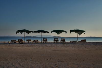 Scenic view of beach against clear sky