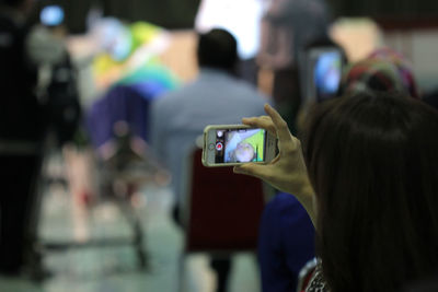 Close-up of man photographing