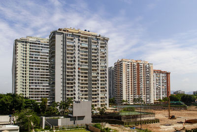 Buildings in city against sky