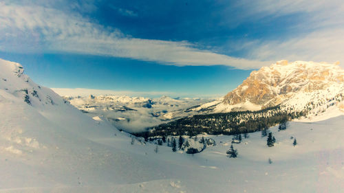 Scenic view of snowcapped mountains against sky