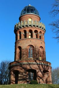 Low angle view of built structure against clear blue sky