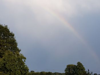 Low angle view of rainbow against sky