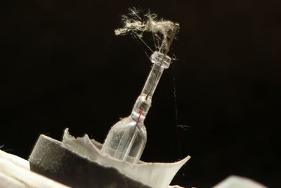 Close-up of electric lamp against black background