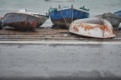 Abandoned boat moored at beach