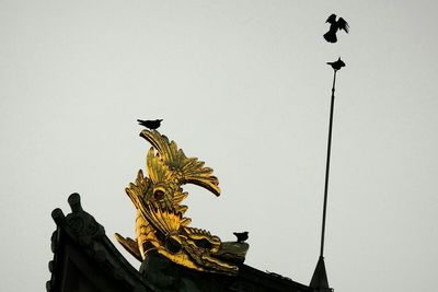 Low angle view of statue against clear sky