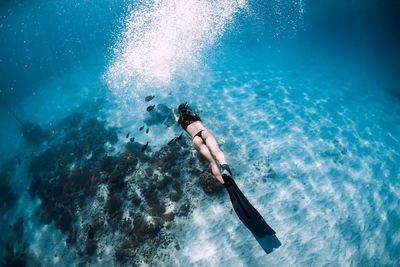 High angle view of man swimming in sea