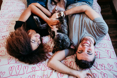 Portrait of smiling young woman lying down