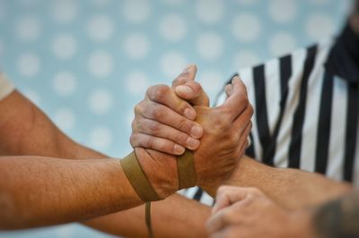 Close-up of man holding hands