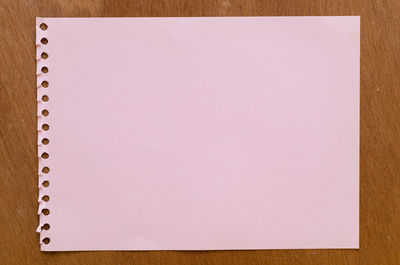 Low angle view of paper against white background