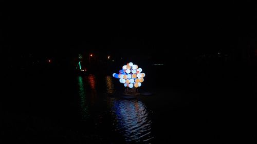 High angle view of illuminated lights in water at night