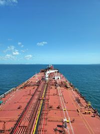 Scenic view of a vessel navigating at sea against sky