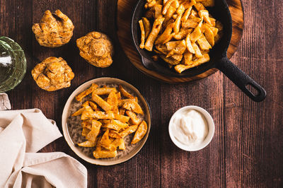 Pieces of celery root fried with paprika on a plate on the table top view