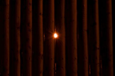 Close-up of illuminated lights at sunset