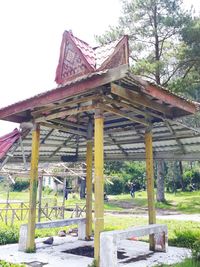 Old ruins of building on field against sky