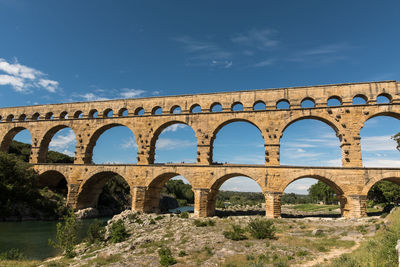 Low angle view of pont du gard bridge against sky in france
