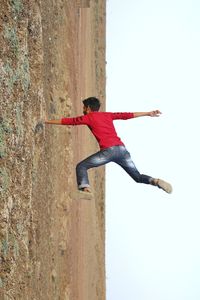 Full length of man on landscape against clear sky