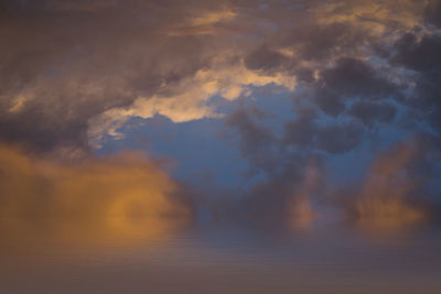 Low angle view of dramatic sky during sunset