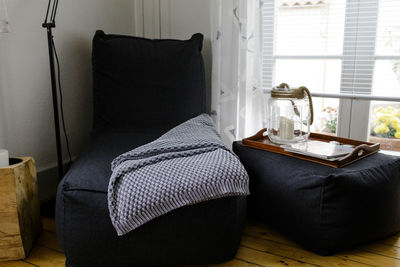 Table and chair on bed at home