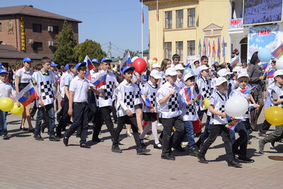 Group of people on street in city