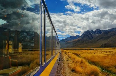 Train on field against sky