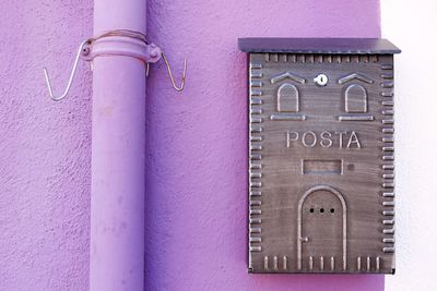 Close-up of mailbox on wall