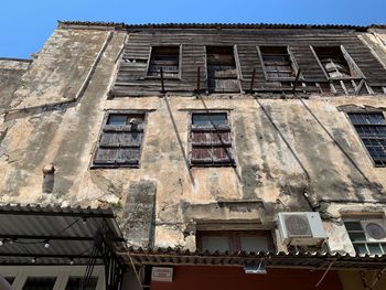 Low angle view of old building against clear sky