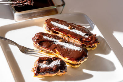 Mocha mousse eclairs with chocolate glaze