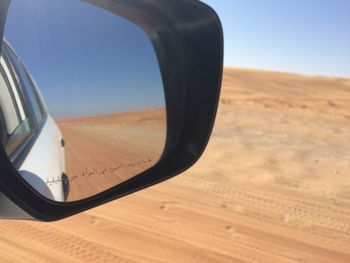 Close-up of sand dunes in desert against sky