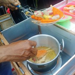 Close-up of man preparing food